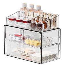 an acrylic makeup organizer with multiple compartments for cosmetics and other personal care items