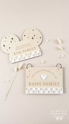 two wooden name tags with mickey mouse ears on them and the words, king family