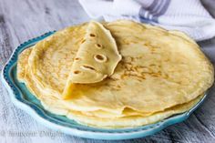 a stack of pancakes on a blue plate