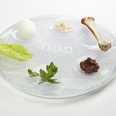 a glass plate with different types of food on it