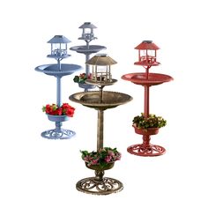 three tiered bird bath with flowers in it