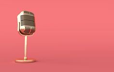 an old fashioned microphone on a pink background