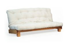 a white futon mattress sitting on top of a wooden frame