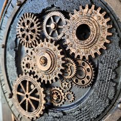 an old clock with gears attached to it