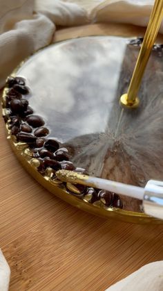 a close up of a plate on a table with a pen and napkins next to it