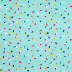 a blue background with multicolored polka dots