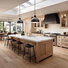 a large kitchen with an island in the middle