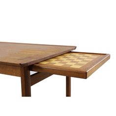 a wooden table with a chess board on it's top and one piece missing