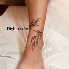 a woman's foot with a leaf tattoo on her left ankle and the bottom part of her leg