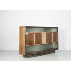 Illuminated "Mid-century" bar cabinet from the 1950s. The cabinet was designed by Vittorio Dassi and made by La Permanent Mobili Cantù. The massive bar cabinet was made of walnut and maple. Behind the doors is an etched mirror with sun and moon symbols. I have official proof of authenticity such as vintage catalogs,   designer records,   or other literature sources and take full responsibility for any authenticity issues arising   from   misattribution Mid Century Bar Cabinet, Etched Mirror, Moon Symbols, Dry Bars, Bar Cabinet, Casegoods, Vintage Items, Mid Century, Bar