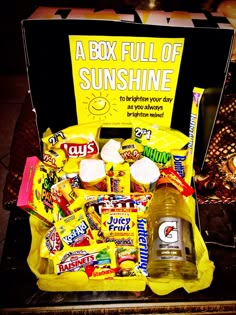 a box full of sunshine candy and drinks