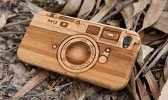 a wooden camera case laying on the ground