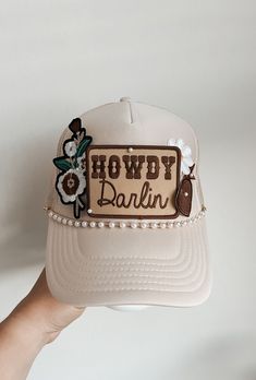 This custom made trucker patch hat is perfect for any occasion whether it be for spring/summer time, a lake hat, a gift for someone, or just a cute accessory to add a little spice to your outfit 🧢✨ DETAILS-  * This hat is one size with an adjustable SnapBack that is adjustable from 20in. - 23.5in. * The color of this hat is Tan * The material of the hat is polyester with iron on patches  REFUNDS AND CANCELLATIONS- Every hat is handmade by me as a result, a slight variation can occur from the pi Iron On Trucker Hat Diy, Iron On Patch Trucker Hat, Kimes Ranch Hat Outfit, Patch Hats Diy, Western Trucker Hats With Patches, Trucker Hat Designs With Patches, Country Trucker Hats, Custom Trucker Hats Patches, Patch Trucker Hat Ideas