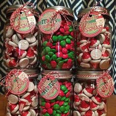 several jars filled with candy sitting on top of a table