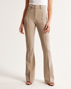 Elevate your wardrobe with the Abercrombie & Fitch Women's High Rise Flare Pant in an elegant Clay Brown. These pants are designed to flatter, fitting snugly at the waist and hips while relaxing slightly at the thigh and flowing into a full-length flare leg. Perfect for a sophisticated look, they feature:

- Size: 32 SHORT
- Color: Clay Brown
- Material: Body - Polyester blend; Pocket Bag - Polyester
- Gender: Female
- Key Details: Stretch menswear fabric, sleek pintuck detail, functional front Tailored Pants Women, High Rise Flare Pants, Female Features, Abercrombie (women), Ankle Dress Pants, Flare Pant, Business Casual Outfits For Work, High Waisted Mom Jeans, Menswear Inspired