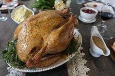 a large turkey sitting on top of a white plate