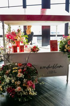 flowers and candles are on display at the store