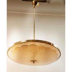 a light fixture hanging from the ceiling in a room