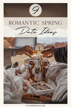 two people toasting wine glasses over a tray with food on it and the words romantic spring date ideas