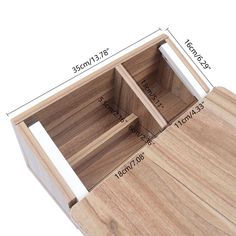 a wooden drawer with measurements for the drawers on each side and an open drawer at the top