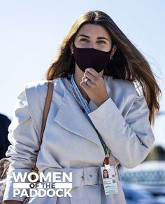 a woman wearing a face mask while walking