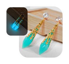 Show off your love of Final Fantasy XIV in a subtle way with these FFXIV Glow in the Dark Aetheryte Earrings! Whether you're at a formal event or a casual outing, these illuminating earrings make a striking statement that is sure to turn heads. Day or night! 𝑬𝒍𝒆𝒈𝒂𝒏𝒕 𝑫𝒆𝒔𝒊𝒈𝒏: These stud style earrings flaunt a glow-in-the-dark, multifaceted resin Seafoam Green crystal that is wrapped in a gold-colored filigree, ensuring you shine in any light. The base of the earring features a sparkly, transparent diamond-esque rhinestone. Extra large stud backings make sure these stay firmly on your ear.  𝑳𝒖𝒙𝒖𝒓𝒚 𝑴𝒆𝒆𝒕𝒔 𝑪𝒐𝒎𝒇𝒐𝒓𝒕: Deceptively lightweight, these long dangle earrings are designed for easy wear, so you can flaunt your style all day (or night) long without discomfort Dark Seafoam Green, Crystal Resin, Stud Style, Final Fantasy Xiv, Long Dangle Earrings, Metal Earrings, Single Earring, Seafoam Green, Green Crystals