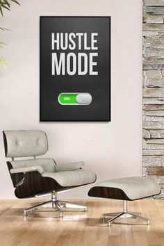 a white chair sitting in front of a black sign that says hustle mode on it