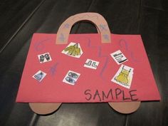 a handbag made out of construction paper with stamps on it and the word sample