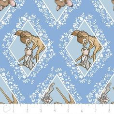 a blue and white pattern with rabbits on it