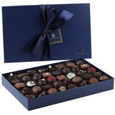 a blue box filled with lots of chocolates