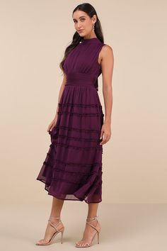 You'll always feel and look your best when you step out for the day in the Happily Sweet Purple Mock Neck Backless Midi Dress! Airy woven chiffon shapes this darling dress that features a sleeveless, lightly gathered bodice and a sophisticated mock neckline. A fitted, banded waist sits atop a breezy, A-line skirt that boasts tiers of ruffled accents as it falls to a chic midi hem. Long tying sashes secure above an open-back cutout for an ultra-alluring finish. Hidden side zipper/clasp. Fit: This garment fits true to size. Length: Mid-calf length. Size medium measures 50.5" from shoulder to hem. Bust: Great for any cup size. Waist: Fitted - very fitted at natural waist. Hip: Not Fitted - fuller skirt allows room for hips. Undergarments: May be worn with an adhesive bra, petals, or no bra. F Sleeveless Georgette Maxi Dress For Cocktail, Midi Chiffon Dress With Ruffles For Garden Party, Midi-length Chiffon Dress With Ruffles For Garden Party, Feminine Chiffon Midi Evening Dress, Bridesmaid Midi Dress With Ruffles, Feminine Evening Chiffon Midi Dress, Feminine Midi-length Chiffon Evening Dress, Purple Sleeveless Chiffon Dress, Feminine Ruched Chiffon Midi Dress