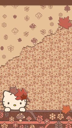 an image of hello kitty with autumn leaves