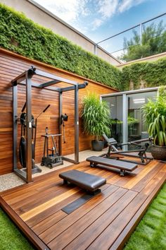 an outdoor gym with exercise equipment and plants