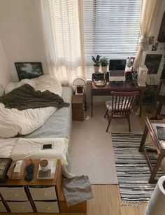 an aerial view of a bedroom with a bed, desk and chair