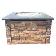 an outdoor sink made out of bricks and stone