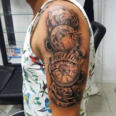 a man with a clock tattoo on his arm