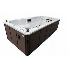 a large hot tub sitting on top of a white floor