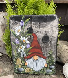 Bring a touch of whimsy to your garden with this charming hand-painted tree trunk sign. Featuring a delightful garden gnome nestled among vibrant flowers and friendly forest critters, this sign is perfect for adding a splash of color and magic to any outdoor space. Details: *Material: High-quality plywood wood, hand-painted with outdoor-grade paint *Dimensions: Approximately 12" x 18" (Width x Height) *Colors: Natural wood background with a colorful gnome in a red hat, flowers and  foliage. *Features: Weather-resistant sealant for durability. *Design: Unique, one-of-a-kind design with a rustic charm.  Trunks shapes are cut freehand and are each unique. Perfect for: *Outdoor gardens *Patios and decks *Indoor plant spaces *Gnome and fairy garden enthusiasts Care Instructions: *Although seale Gnome Tree, Forest Critters, Plant Spacing, Vibrant Flowers, Garden Gnome, Whimsical Garden, Vibrant Flower, Red Hat, Gnome Garden