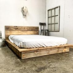 a bed sitting in the middle of a room