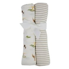 two baby swaddles wrapped in white and brown striped fabric with animals on them