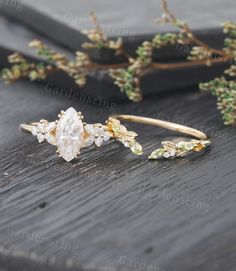 an image of wedding accessories on the table with flowers and greenery in the background