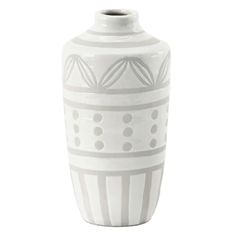 a large white vase with designs on the outside and inside, sitting against a white background