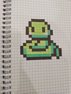 a notebook with an image of a cartoon character in pixel art on the front cover