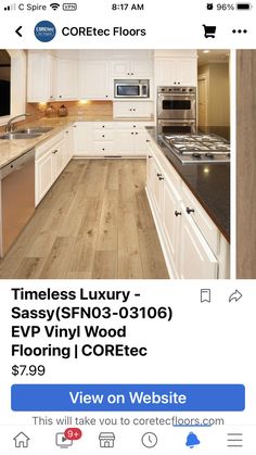 a white kitchen with wood flooring on the side and an advertise to sell it