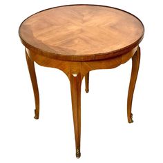 a round wooden table with two legs