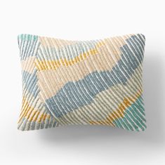 a blue and yellow pillow on a white background