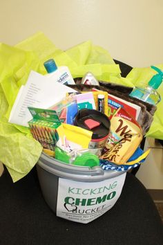 a bucket filled with items sitting on top of a chair