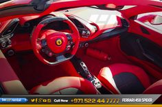 the interior of a red sports car is shown