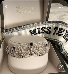 a tiara in a box with the name misste on it and ribbon around it