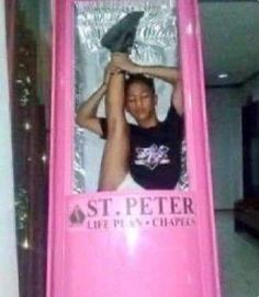 there is a pink sign that says st peter life in the city on it and an image of a woman holding a shoe